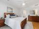 Bedroom with a wood bed frame and wood dresser plus view into Primary bathroom at 310 Heidinger Dr, Cary, NC 27511