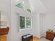 Bedroom with a triangular window above a large window and wood parquet flooring at 310 Heidinger Dr, Cary, NC 27511