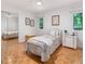 Cozy bedroom features hardwood floors, a full size bed, and a mirrored closet at 310 Heidinger Dr, Cary, NC 27511