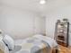 Bright bedroom featuring a full size bed, hardwood floors, and open storage at 310 Heidinger Dr, Cary, NC 27511