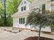 Exterior of the home featuring a side view and landscaped walkway with garden boxes at 310 Heidinger Dr, Cary, NC 27511