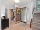 Welcoming foyer with tile flooring, a staircase, and access to other rooms at 310 Heidinger Dr, Cary, NC 27511