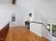 Upstairs hallway with vaulted ceiling, hardwood floors, and natural light at 310 Heidinger Dr, Cary, NC 27511