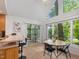 Breakfast nook featuring a table and chairs, and a sliding door leading to the sunroom at 310 Heidinger Dr, Cary, NC 27511
