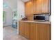 Wooden cabinets and stainless steel microwave, offering ample storage space in the kitchen at 310 Heidinger Dr, Cary, NC 27511