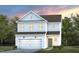 Charming two-story home featuring a welcoming facade and a well-manicured front lawn at 3214 Pelican Ln, Durham, NC 27703