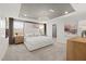 Spacious main bedroom featuring tray ceilings, carpeted floors, and abundant natural light at 3214 Pelican Ln, Durham, NC 27703