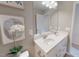 Bright bathroom featuring a double vanity, neutral walls, and a decorative mirror, creating a clean and modern aesthetic at 3225 Pelican Ln, Durham, NC 27703