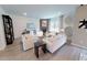 Cozy living room featuring stylish decor, comfortable seating and a stone fireplace at 3225 Pelican Ln, Durham, NC 27703