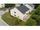 Aerial view of a two-story home with a dark roof and a well-kept lawn in a neighborhood at 3705 Rivermist Dr, Raleigh, NC 27610