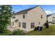 Two-story home featuring a cozy back patio area and a well-manicured lawn at 3705 Rivermist Dr, Raleigh, NC 27610
