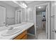 Neutral bathroom with a large mirror, vanity, and shower/tub combo at 3705 Rivermist Dr, Raleigh, NC 27610