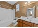 Cozy bathroom features a shower-tub combo, toilet, and wooden vanity at 3705 Rivermist Dr, Raleigh, NC 27610
