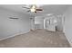 Open bonus room with neutral walls, carpet flooring, and a ceiling fan at 3705 Rivermist Dr, Raleigh, NC 27610