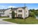 Inviting exterior of a two-story home with manicured landscaping and a view of the surrounding neighborhood at 3705 Rivermist Dr, Raleigh, NC 27610