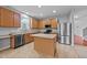 Updated kitchen with stainless appliances, an island, and plenty of counter space at 3705 Rivermist Dr, Raleigh, NC 27610