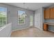 Cozy breakfast nook with tile flooring, ample natural light, and a built-in desk area at 3705 Rivermist Dr, Raleigh, NC 27610