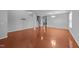 Open-concept living room with gleaming hardwood floors, neutral walls, and abundant natural light at 3705 Rivermist Dr, Raleigh, NC 27610