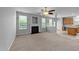 Spacious living room featuring a cozy fireplace, lots of natural light, and a seamless layout to the kitchen at 3705 Rivermist Dr, Raleigh, NC 27610