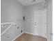 Mudroom with a white door, tile floor, an extinguisher, and coat hooks at 3705 Rivermist Dr, Raleigh, NC 27610