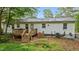 Exterior view of home, showing a wooden deck, and a cultivated garden at 3803 Jonesville Rd, Wake Forest, NC 27587