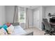 Comfortable bedroom with daybed, desk with computer, and bright natural light at 3803 Jonesville Rd, Wake Forest, NC 27587