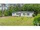 Charming one-story home features black shutters and a well-manicured lawn at 3803 Jonesville Rd, Wake Forest, NC 27587