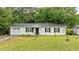 Charming one-story home features black shutters and a well-manicured lawn at 3803 Jonesville Rd, Wake Forest, NC 27587