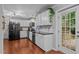 Modern kitchen featuring stainless steel appliances, white cabinets, and granite countertops at 3803 Jonesville Rd, Wake Forest, NC 27587