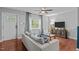 Cozy living room with a large window and comfortable seating arrangement at 3803 Jonesville Rd, Wake Forest, NC 27587