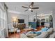 Open-concept living room with a view into the kitchen and modern furnishings at 3803 Jonesville Rd, Wake Forest, NC 27587