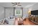 Cozy living room with a large window and comfortable seating arrangement at 3803 Jonesville Rd, Wake Forest, NC 27587