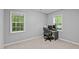 Bright office features a computer desk, a swivel chair and natural lighting at 3803 Jonesville Rd, Wake Forest, NC 27587