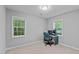 Bright office features a computer desk, a swivel chair and natural lighting at 3803 Jonesville Rd, Wake Forest, NC 27587