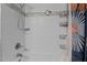 Clean shower space with white tile, shelving, and modern fixtures at 3803 Jonesville Rd, Wake Forest, NC 27587
