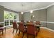 Spacious dining area with a large window and seating for eight at 4021 Chaumont Dr, Apex, NC 27539