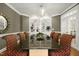 Charming dining room with a built-in bookshelf and a large table at 4021 Chaumont Dr, Apex, NC 27539