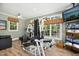 Home gym featuring exercise equipment, wood floors, a ceiling fan, and a wall-mounted television at 4021 Chaumont Dr, Apex, NC 27539