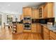 Spacious kitchen featuring stainless steel appliances, light wood cabinets, and a large window at 4021 Chaumont Dr, Apex, NC 27539