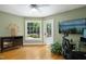 A light-filled office with a large window overlooking the outdoor space, ideal for a peaceful workspace at 4021 Chaumont Dr, Apex, NC 27539