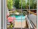 Beautiful view of the outdoor pool area with a waterfall and seating, perfect for relaxation and entertainment at 4021 Chaumont Dr, Apex, NC 27539