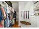 Organized walk-in closet with custom shelving and hanging space at 4021 Chaumont Dr, Apex, NC 27539