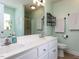 Bathroom features a double sink vanity with a large mirror, a tiled floor, and a glass enclosed shower at 4132 Battle Field Dr, Garner, NC 27529