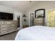 Bedroom showcasing two dressers, a mirror, and a partial view of an ensuite bathroom at 4132 Battle Field Dr, Garner, NC 27529