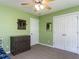 Bright bedroom featuring dresser, closet, and ceiling fan at 4132 Battle Field Dr, Garner, NC 27529
