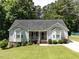 Charming single-story home featuring a manicured lawn, bay windows, and inviting front porch at 4132 Battle Field Dr, Garner, NC 27529