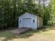 Exterior of a storage shed with roll-up door at 4132 Battle Field Dr, Garner, NC 27529