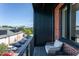 Cozy balcony with a chair, brick accents, and views of the surrounding neighborhood at 414 Chavis Way, Raleigh, NC 27601