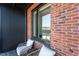 Inviting balcony with comfortable seating and a view of the neighborhood at 414 Chavis Way, Raleigh, NC 27601