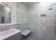 Modern bathroom with a walk-in shower featuring marble tile, a built-in bench, and contemporary fixtures at 414 Chavis Way, Raleigh, NC 27601